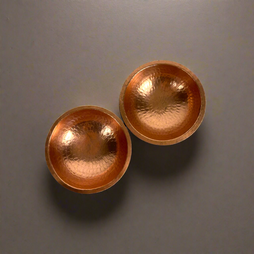 Capture attention with Ailan Teak Wood & Copper Bowls. The combination of teak and copper creates a stunning texture and dimension for any space. A remarkable decorative addition in any room.