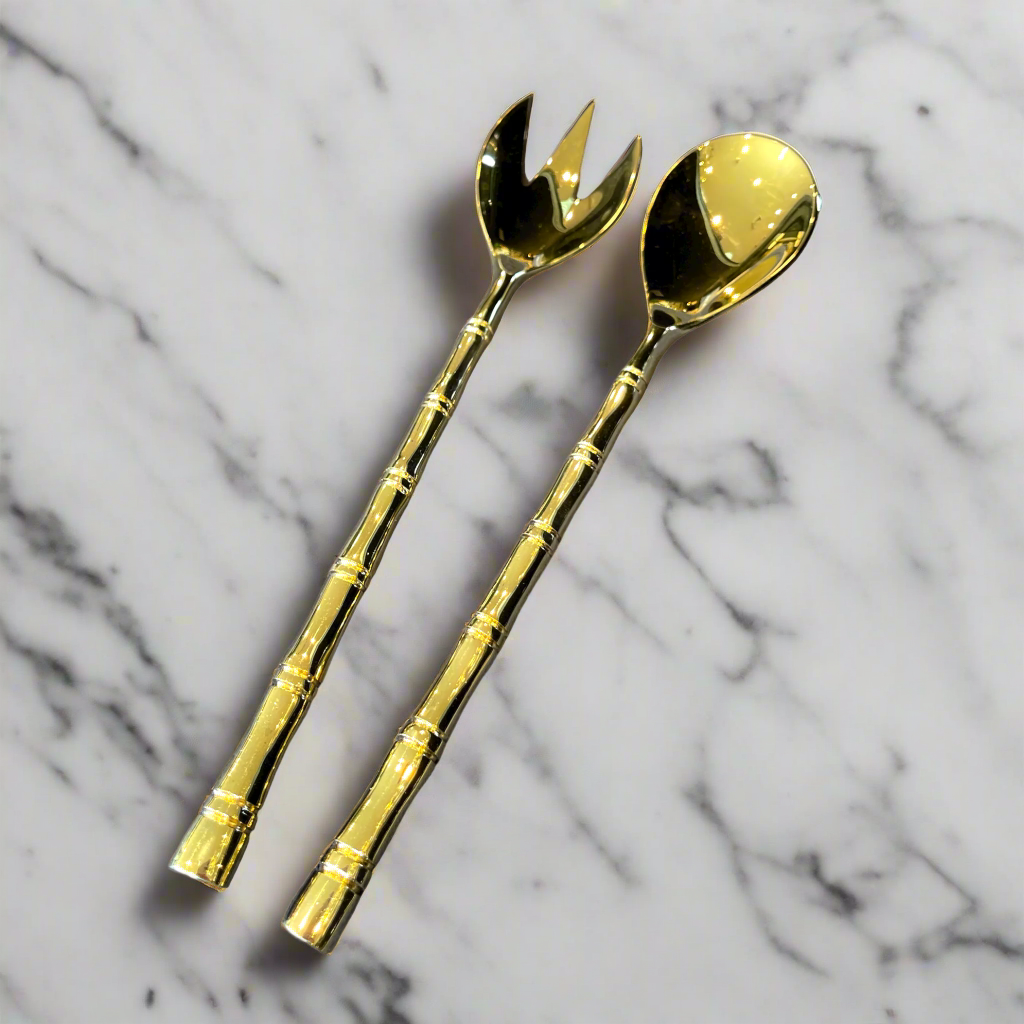 Experience the luxurious touch of the Solid Brass Bamboo Serving Spoon & Fork - Set Of 2. These exquisitely crafted utensils offer a sleek design with a weighty, substantial feel, elevating your everyday dining experience.
