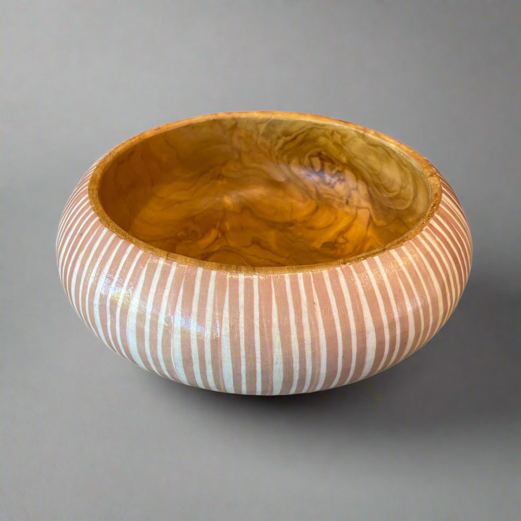 Artfully designed, our Handcrafted Batik & Teak Wood Bowl lend just the right amount of texture and dimension to your table. Formed from teak wood, the warm reddish-brown hues and beautiful natural grains perfectly pair with the playful Batik pattern.