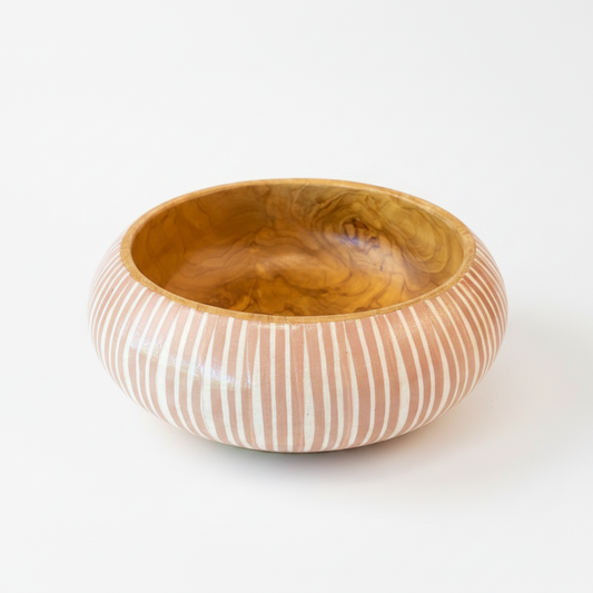 Artfully designed, our Handcrafted Batik Teak Wood Bowl lend just the right amount of texture and dimension to your table. Formed from teak wood, the warm reddish-brown hues and beautiful natural grains perfectly pair with the playful Batik pattern.