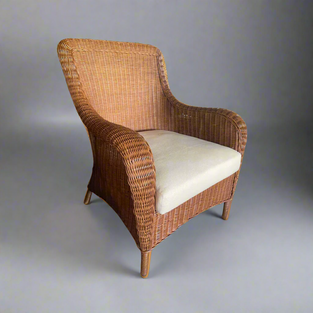 Experience the unparalleled natural style of the Kenyamanan Rattan Armchair. With traditional techniques and skilled craftsmanship, this armchair boasts a timeless design that exudes comfort and beauty. Made from rattan material, it offers a tactile and natural touch. The ergonomically constructed deep seat and high curved back guarantee maximum comfort. Enhance its style with a scatter cushion or throw to elevate your comfort to the next level. Front