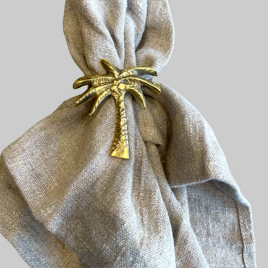 Our solid brass napkin ring. Featuring a fun Coconut Tree design. The perfect addition to the elegance of your dining table. Front