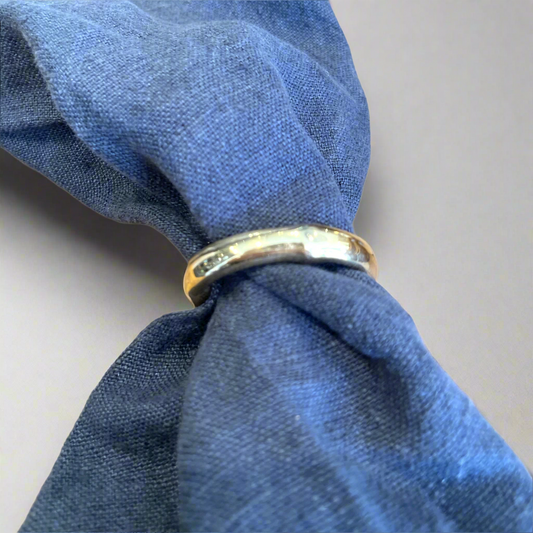 Our brass bamboo shaped napkin rings instantly elevate napkins and table settings. Front