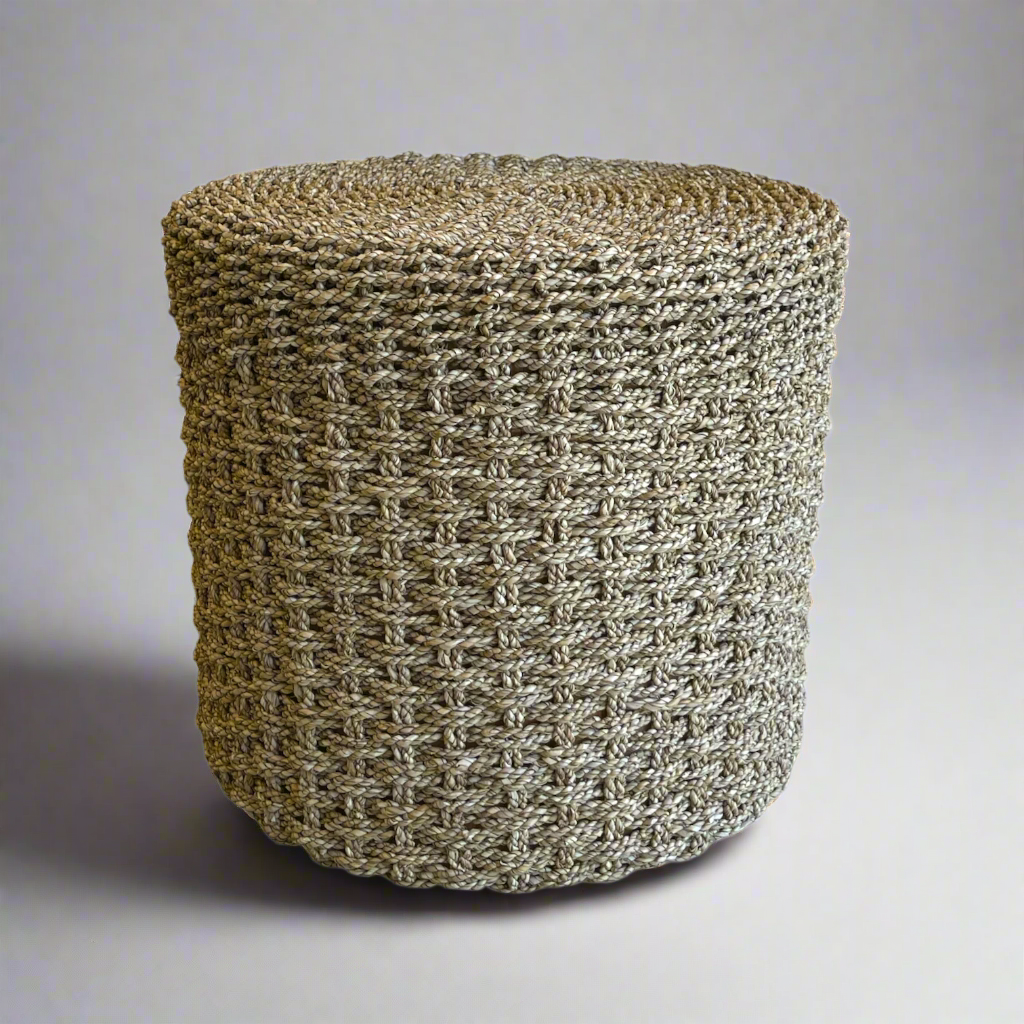 The Kursi Seagrass Side Table is a beautiful addition to seating areas or bedrooms. Woven from seagrass, the tight weave gives a dimensional quality to this table, adding a sense of movement and individuality. Front