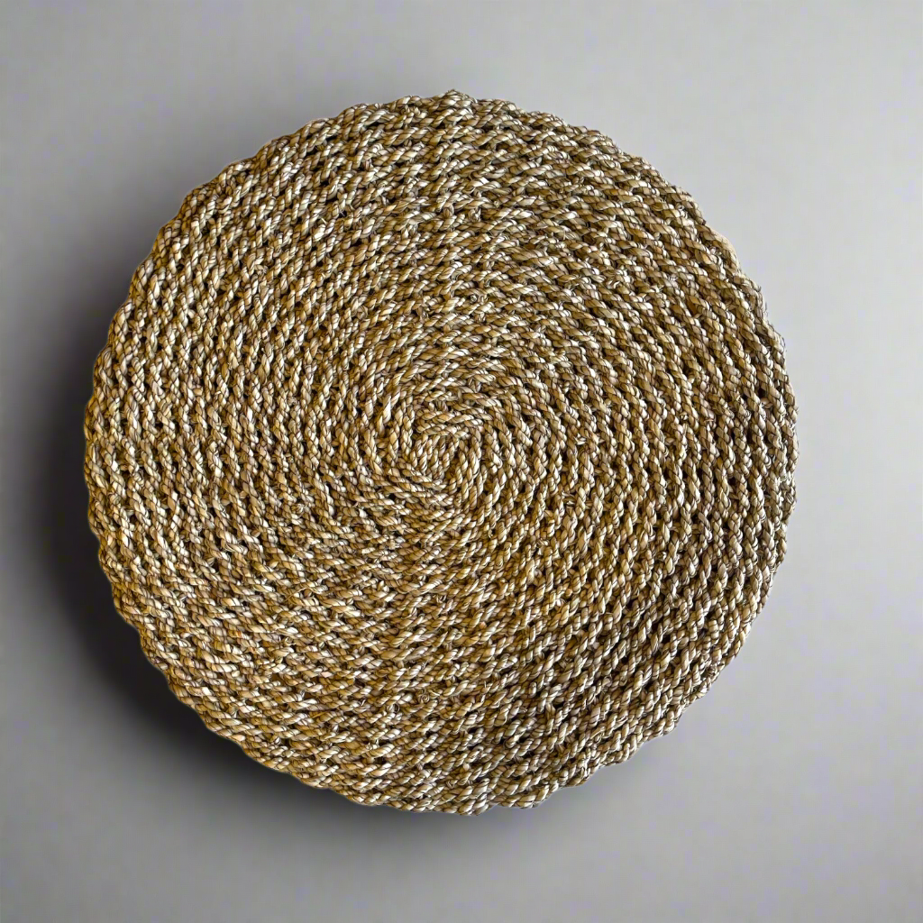 The Kursi Seagrass Side Table is a beautiful addition to seating areas or bedrooms. Woven from seagrass, the tight weave gives a dimensional quality to this table, adding a sense of movement and individuality. Top