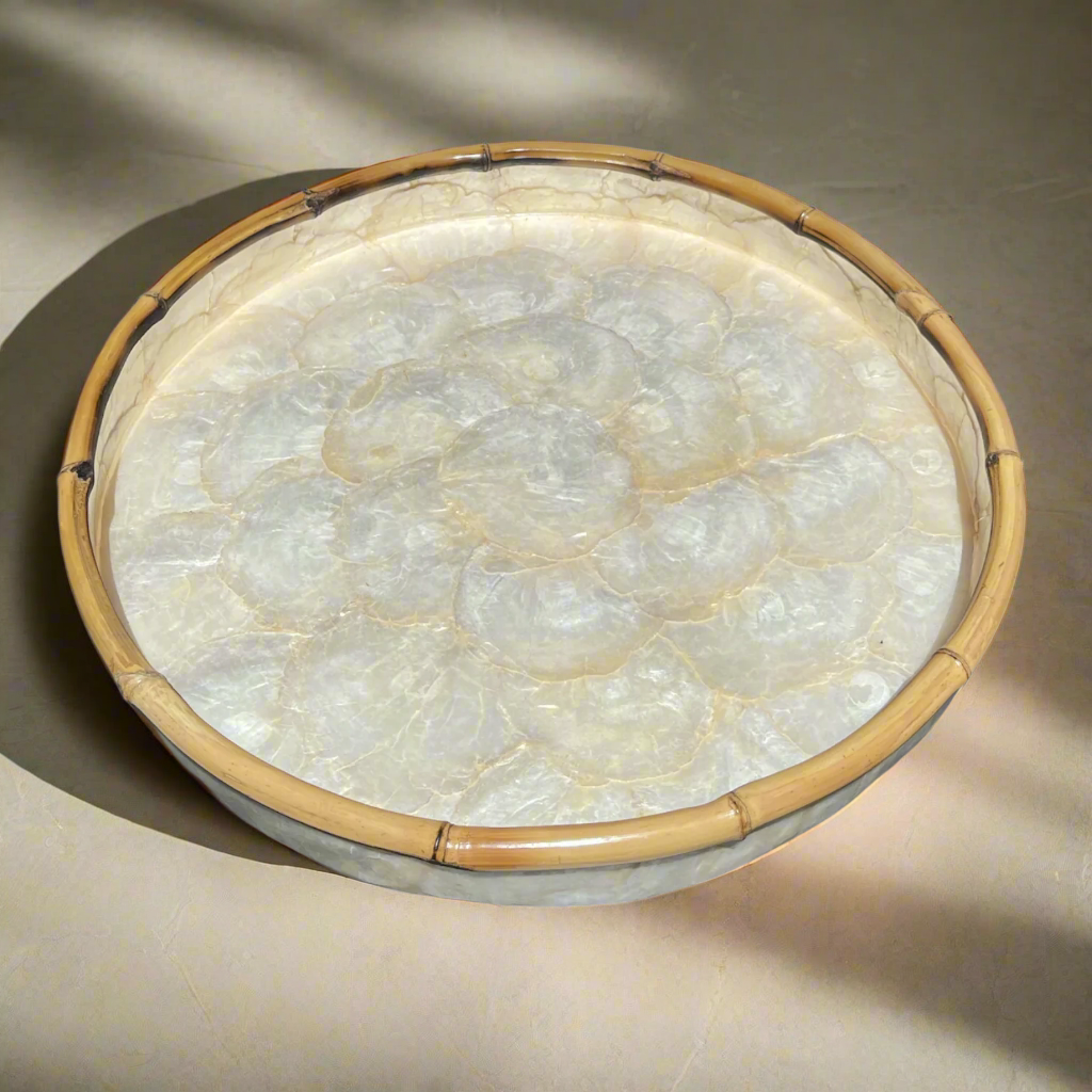 Our beautiful Capiz & Bamboo Round Tray is sleek and elegant, easy to style on your console or coffee table. Top