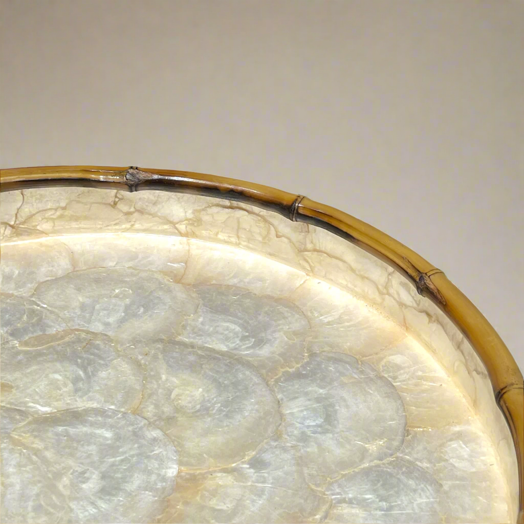 Our beautiful Capiz & Bamboo Round Tray is sleek and elegant, easy to style on your console or coffee table. Corner