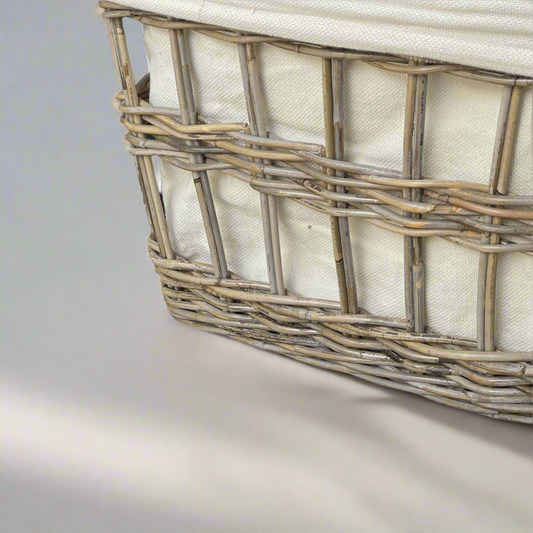 These beautiful rattan baskets are handmade in South East Asia. With a natural look and feel, the Lili Basket brings always welcome additional storage capacity to your living space. Close up.