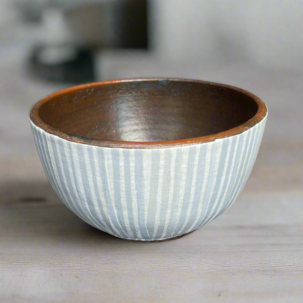 Artfully crafted, the unique Handcrafted Langit Batik & Terracotta Striped Blue Bowl lends just the right amount of texture and dimension to your table. Formed from terracotta, the warm reddish-brown terracotta hues and beautiful natural grains perfectly pair with the playful handcrafted blue Batik pattern.