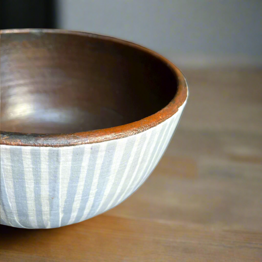 Artfully crafted, the unique Handcrafted Langit Batik & Terracotta Striped Blue Bowl lends just the right amount of texture and dimension to your table. Formed from terracotta, the warm reddish-brown terracotta hues and beautiful natural grains perfectly pair with the playful handcrafted blue Batik pattern.