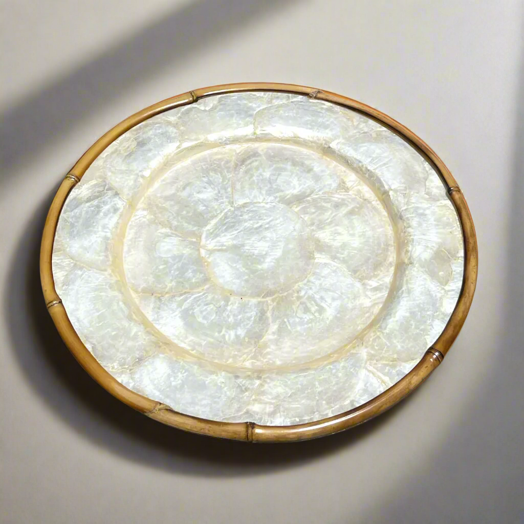 Elevate your dining experience and impress your guests with this stunning Round Capiz Charger Plate, guaranteed to add charm and elegance to any table setting.