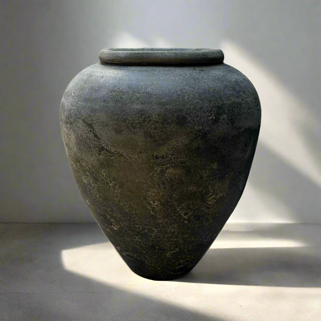 With a classic, traditional shape, this textured vase has a rustic pared-back look giving this decorative piece character.
