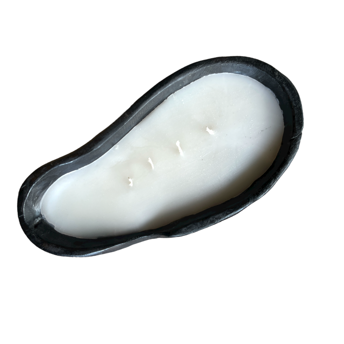 Experience the one-of-a-kind beauty of the Handcarved Baki Teak Candle, crafted from the natural root of a teak tree and filled with the highest quality wax for an unparalleled lighting experience. Top.