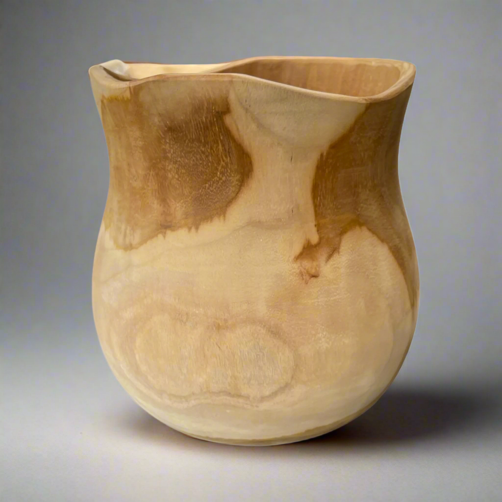 Lovingly hand-carved from solid teak, our Gunung Teak Bowl features the best of both organic and airy design. With a light hue and plenty of natural knots and grains, each bowl is unique.