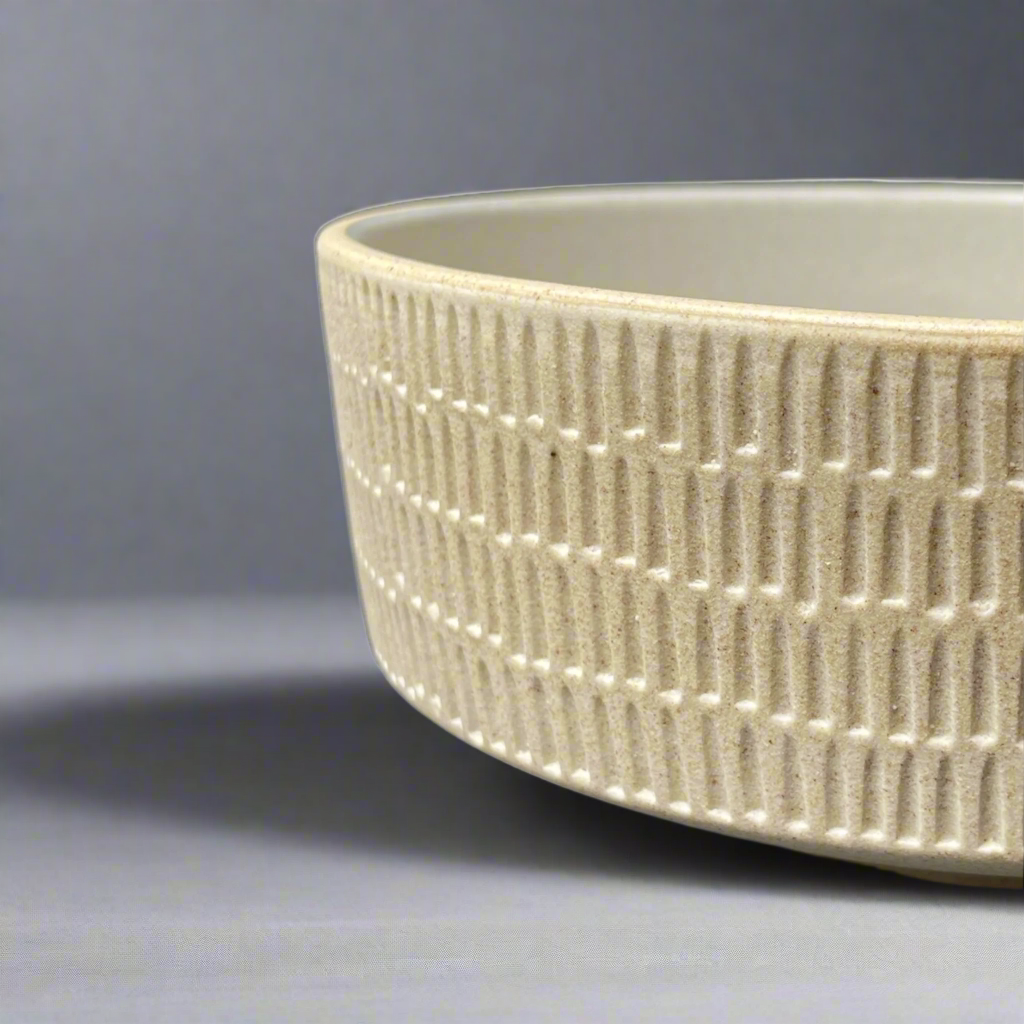 The Tembi Bowl boasts a simple yet contemporary shape and is perfect for adorning your everyday table scape with timeless style. Side.