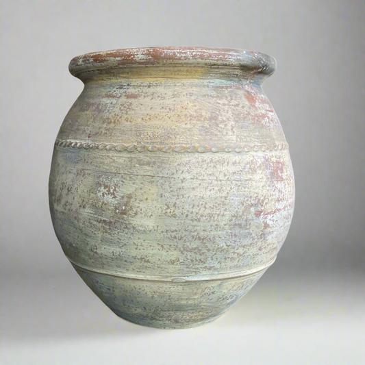 This Terracotta Pot boasts an impressive, aged exterior with attractive limewashed details that complement a variety of styles and spaces. Its generous size is ideal for both greenery and flowers, while the raised texture and rustic colors add a charming touch.