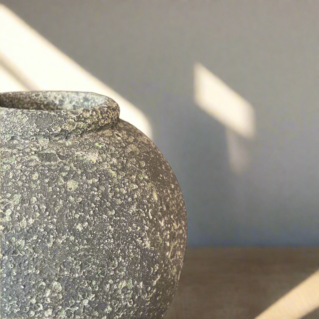 Experience the rustic charm and character of our classic Riveria Terracotta Pot. Made from high-quality terracotta and featuring a beautifully textured green finish, this traditional vase is the perfect decorative piece for any home. detail