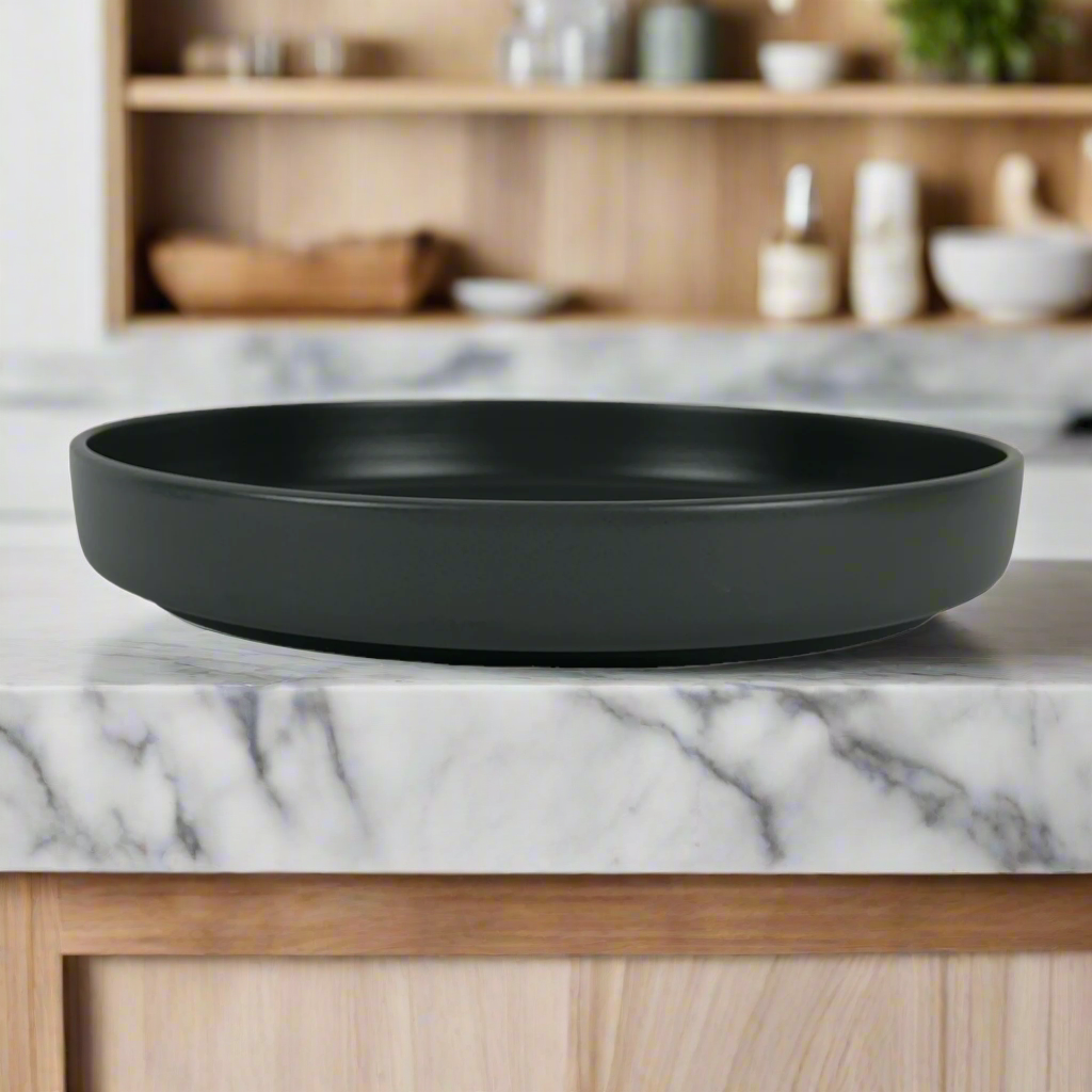 Experience the beauty and taste of salads and pasta like never before with our Elemen Black Ceramic Bowl. Elevate your dining experience with its perfect presentation and irresistible appeal.