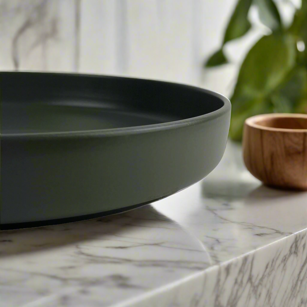 Experience the beauty and taste of salads and pasta like never before with our Elemen Black Ceramic Bowl. Elevate your dining experience with its perfect presentation and irresistible appeal. Detail.