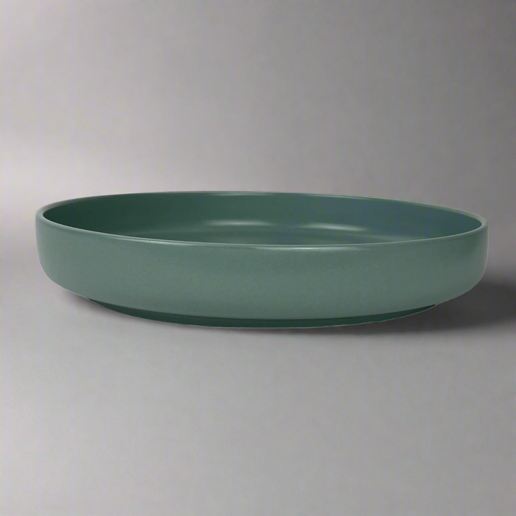 Indulge in the beauty of your salads and elevate your pasta experience with our medium depth, Handmade Kaya Blue Ceramic Bowl.