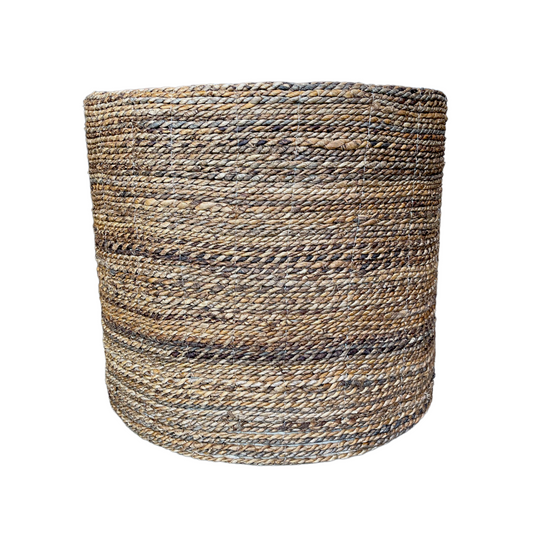 Transform your home with our Meja Side Table's beautifully handwoven texture. Skillfully crafted in South East Asia and designed in a durable cylindrical shape, this piece exudes both style and strength. Made from natural tones of water hyacinth, it is the perfect addition to any space. Front