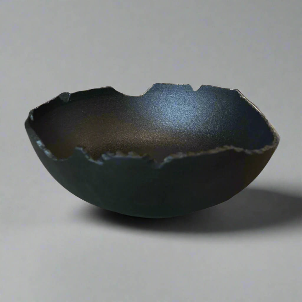 A balance of imperfection and delicate form, the Nusa Bowl features a unique design that will ensure this bowl effortlessly holds its own whether styled on a table or even in your kitchen adding an unusual and found dimension.