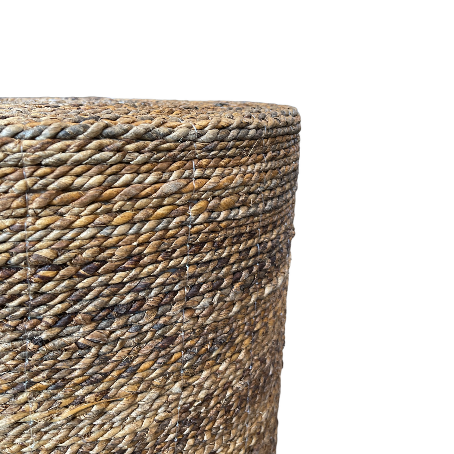 Transform your home with our Meja Side Table's beautifully handwoven texture. Skillfully crafted in South East Asia and designed in a durable cylindrical shape, this piece exudes both style and strength. Made from natural tones of water hyacinth, it is the perfect addition to any space. Corner
