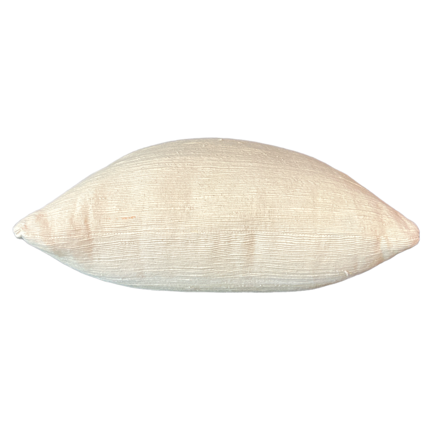 Experience the luxurious beauty of the Kediri Handwoven Cotton Cream Cushion, a sophisticated and versatile addition to your decor. Its elegant neutral tones and indulgently comfortable insert create a truly exceptional piece. Side.