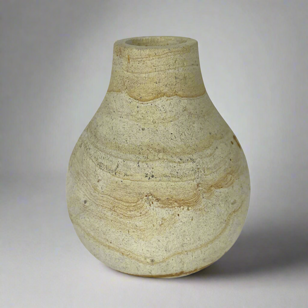 With a classic shape and natural curvatures, the Harta Wood Stone Vase has been lovingly hand-carved to create a truly eye-catching piece. Front