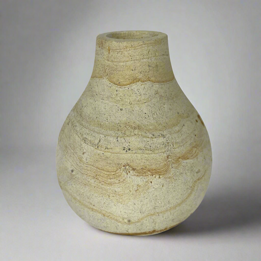 With a classic shape and natural curvatures, the Harta Wood Stone Vase has been lovingly hand-carved to create a truly eye-catching piece. Front