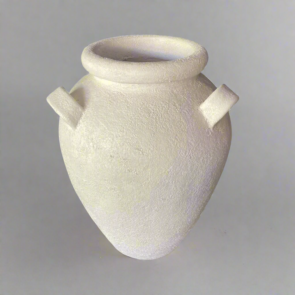 The Nimes Pot showcases a white matte textured finish that exudes a clean and timeless look, making it perfect for styling with a variety of lush greenery. Handcrafted in southeast Asia from authentic terracotta.