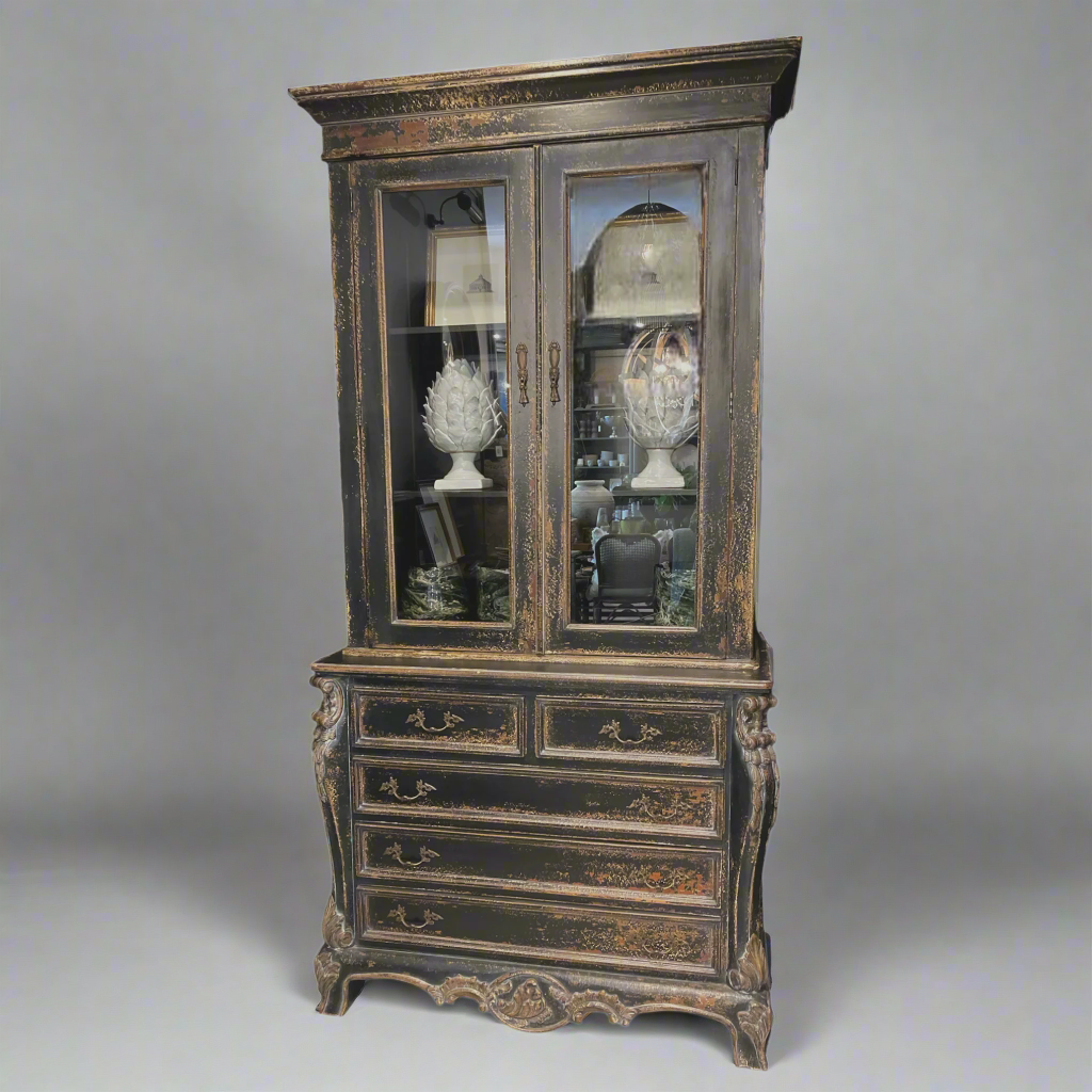 Crafted from Mahogany Wood and carefully distressed for a timeworn appearance, the Alsace Display Cabinet is an exquisite representation of French carpentry at its finest. With 2 glass doors and 5 drawers, it offers excellent storage and display capabilities, making it a truly exceptional piece. Front
