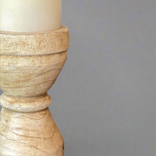 We love the chunky yet elegant Capri Cream Distressed Teak Candle Holder. Their soft curves and shapes accentuate the beauty of the natural recycled teak that have been gently distressed for vintage appeal. They are substantial enough to work on their own or as a beautiful collection of candle holders on a mantelpiece or a table. Detail.