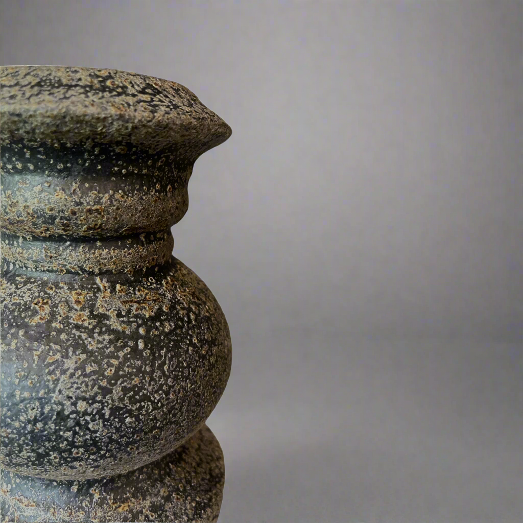 Crafted from terracotta, the chunky yet elegant Vienna Terracotta Candle Holder is substantial enough to work on their own or as a beautiful collection of candle holders on a mantelpiece or a table. Close up.