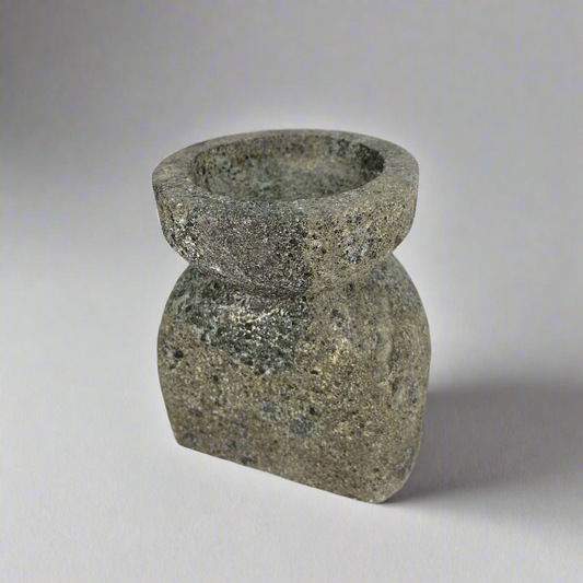 Experience the captivating soft glow of the Bari Black Laval Stone Candle Holder, the perfect balance of strength and grace. Illuminate any space with this elegant yet sturdy piece, creating a tranquil atmosphere that soothes the senses.