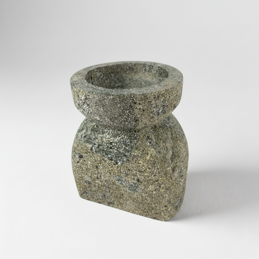 Experience the captivating soft glow of the Bari Black Laval Stone Candle Holder, the perfect balance of strength and grace. Illuminate any space with this elegant yet sturdy piece, creating a tranquil atmosphere that soothes the senses.