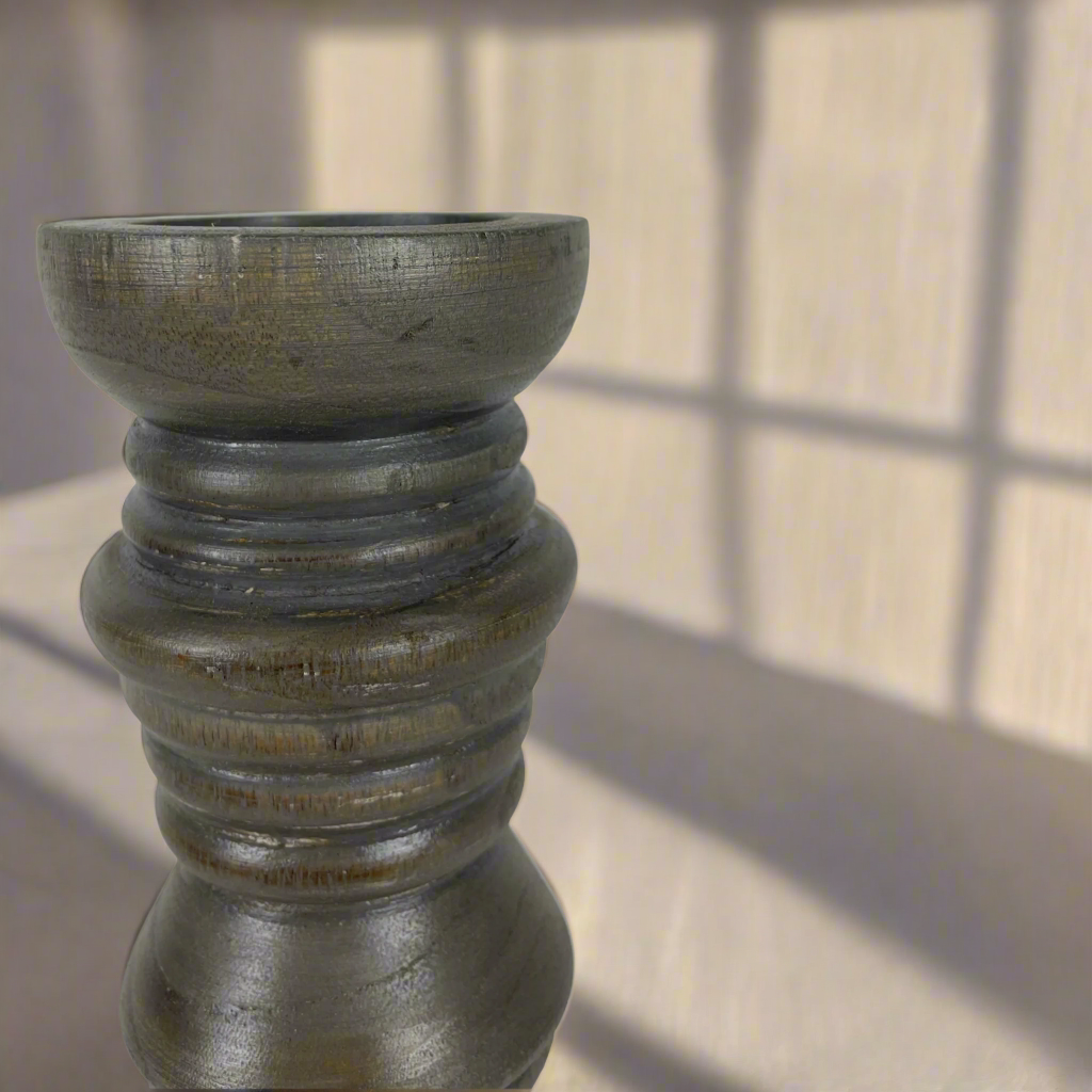 We love the chunky yet elegant Vignola Grey-washed Teak Candle Holder. Their soft curves and shapes accentuate the beauty of the natural recycled teak. They are substantial enough to work on their own or as a beautiful collection of candle holders on a mantelpiece or a table. Close up.