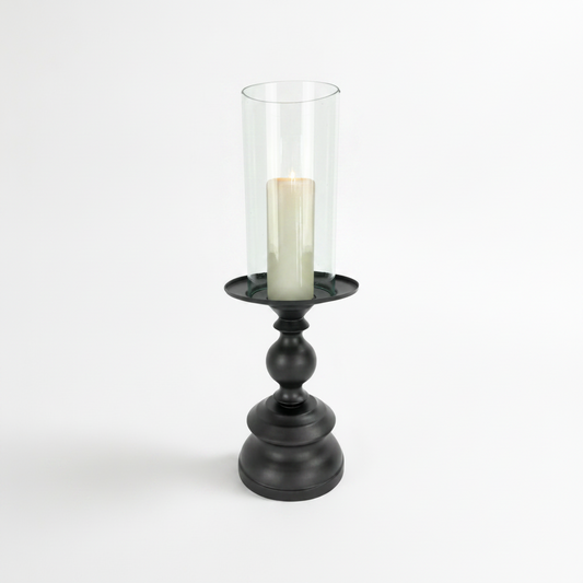 Crafted from bronzed copper, the elegant contours of our Tembaga Copper Candle Holder has a refined elegant feel. The classic design displays a church pillar candle perfectly, creating a soft ambient aesthetic.