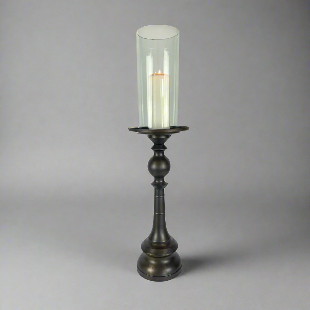 Crafted from bronzed copper, the elegant contours of our Rocca Copper Candle Holder has a refined elegant feel. The classic design displays a church pillar candle perfectly, creating a soft ambient aesthetic.