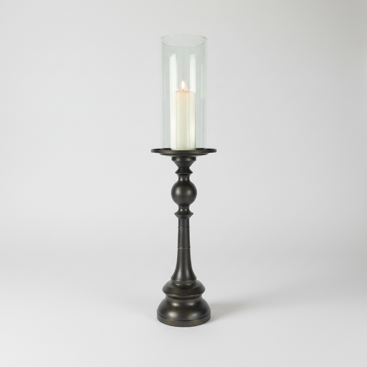 Crafted from bronzed copper, the elegant contours of our Rocca Copper Candle Holder has a refined elegant feel. The classic design displays a church pillar candle perfectly, creating a soft ambient aesthetic.