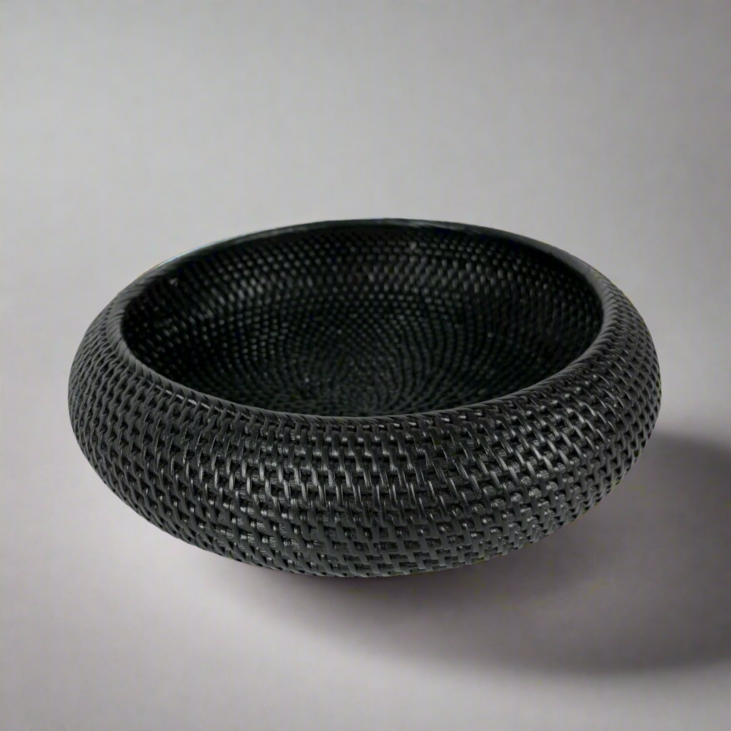 Get ready to elevate your home decor with our Bergaya Black Rattan Bowl. Carefully crafted with an artful touch, this stylish piece will add a beautiful texture to any room, instantly capturing attention and admiration.