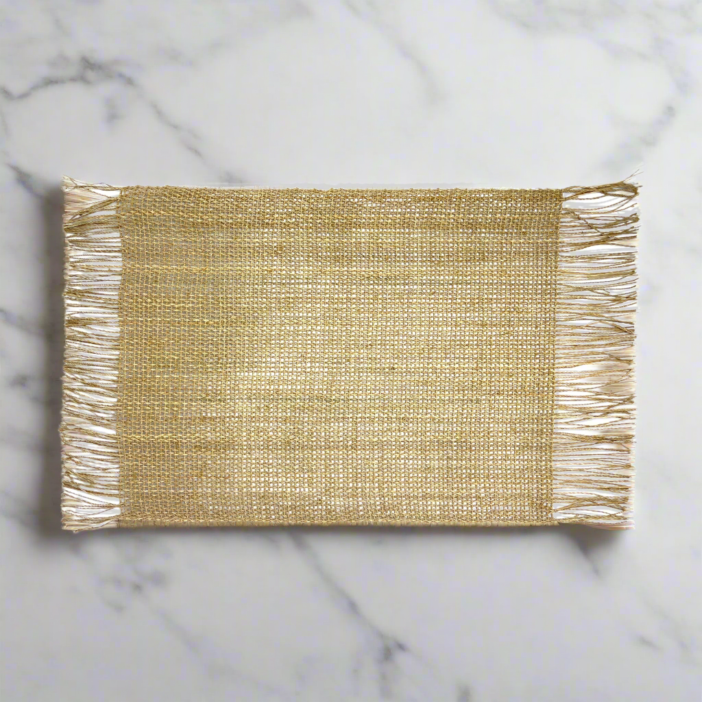 With a delicate fringe, our warm-toned Cahya Natural Fringed Placemat is a welcoming addition to table settings.
