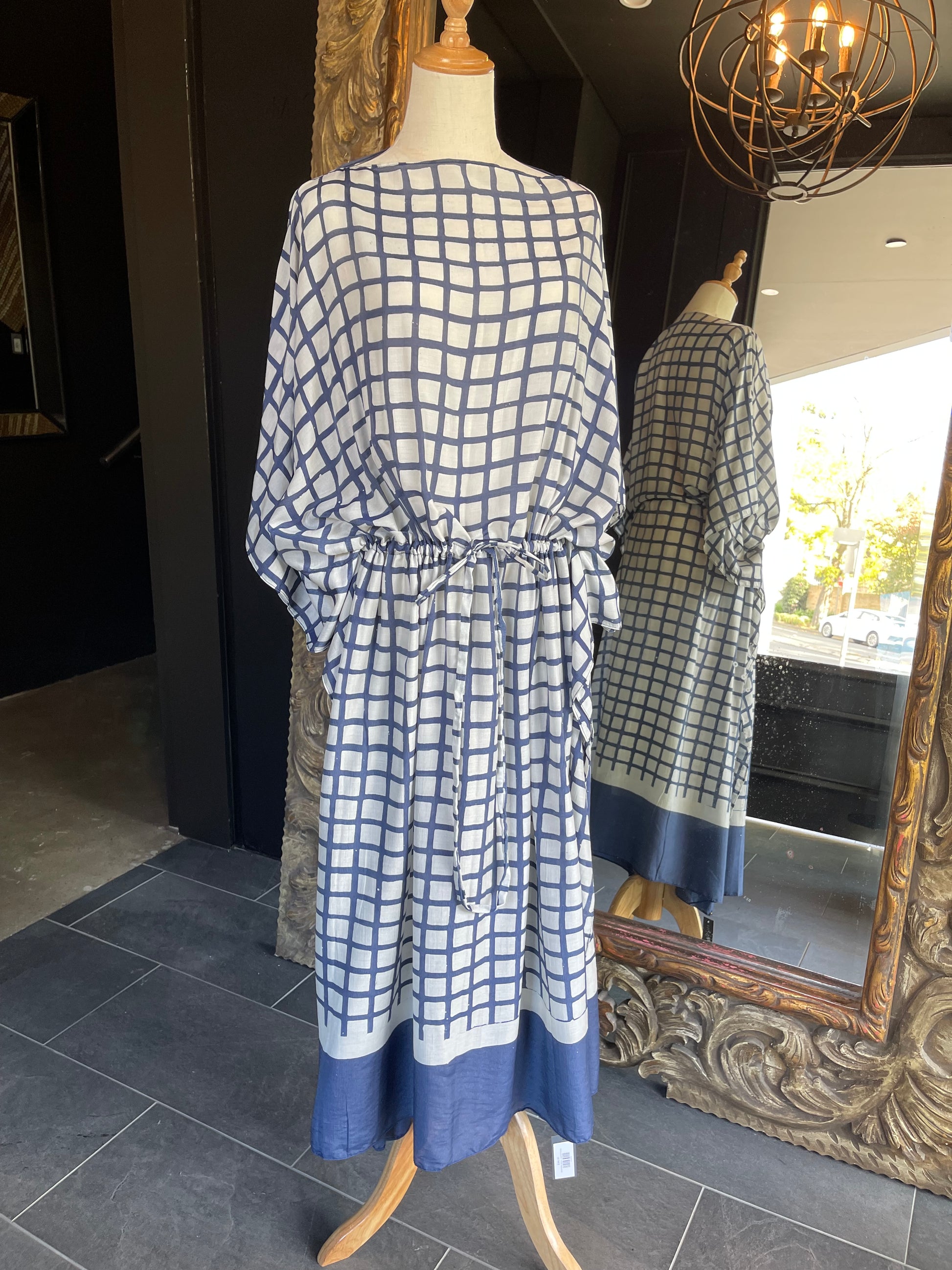 Experience luxurious comfort in this handmade kaftan from Indonesian designer Warwick Purser. Crafted from breathable bamboo crepe with traditional batik printing, it offers lightweight protection against the heat and is perfect for travelling. The drawstring cinches for a flattering fit.