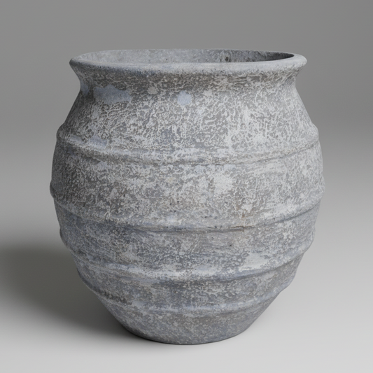 Textured stone vase on a gray background