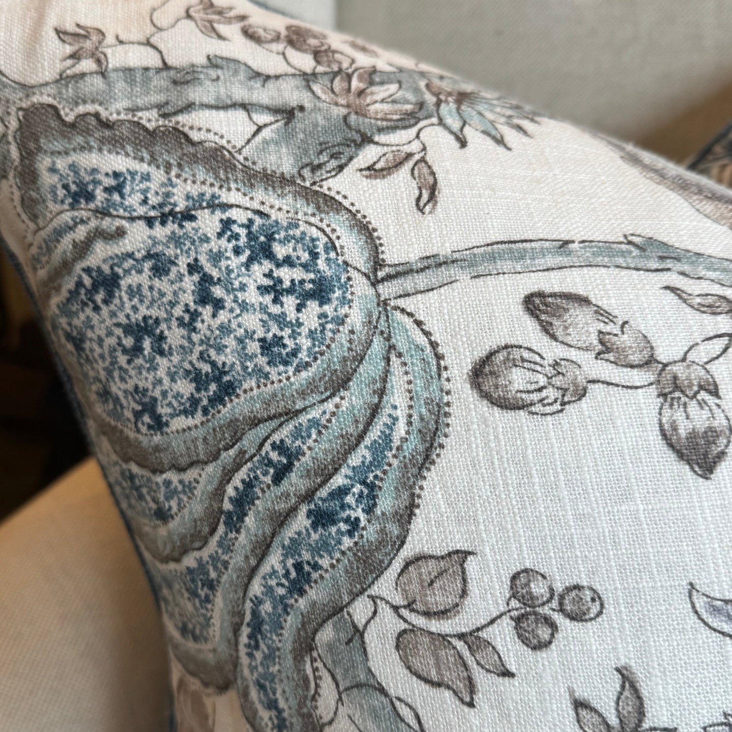 Indulge in the beauty of nature with this exquisite floral cushion by P Kaufmann Fabric House. Featuring a captivating double-sided navy and light blue floral pattern against a luxurious ivory backdrop, accented by navy linen piping from Westbury Fabrics. And for that perfect finishing touch, it comes with a feather insert for unparalleled comfort.