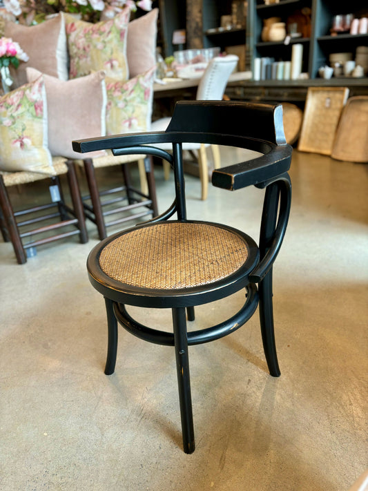 The Louis Chair is a stylish and versatile piece, crafted from oak with a striking black frame and natural rattan seat. Its elegant yet modern design is perfect for adding a touch of style to any home, creating timeless appeal. Front