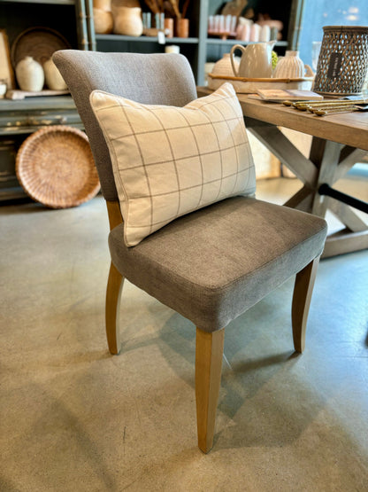 The Chelsea Dining Chair is constructed with a grey linen finish and features stud detailing on the back for a sophisticated, yet comfortable aesthetic. Front