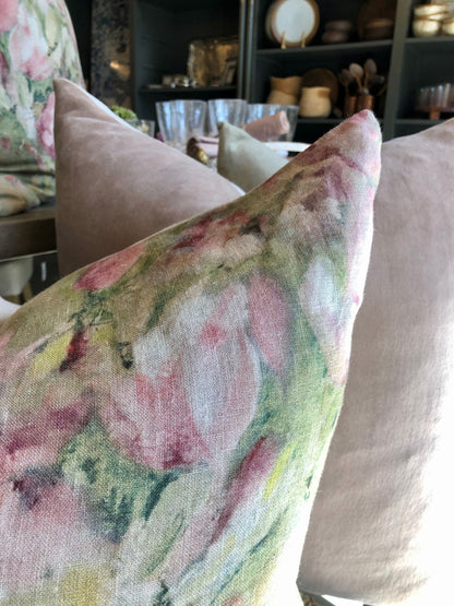 The Magnolia Floral Limone Linen Cushion celebrates the beauty of Spring with its vibrant pink magnolia flowers on a 100% linen background. An ideal addition to any home, this cushion is perfect for bringing life and style to any room. Comes complete with a luxurious feather filled insert. Close up corner.