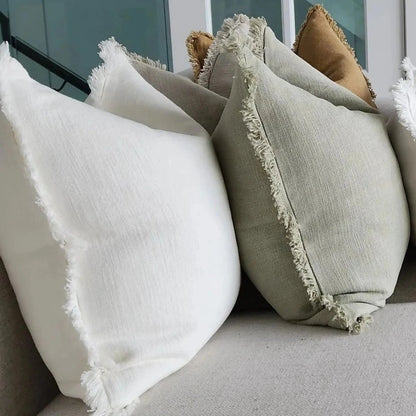 Indulge in the luxurious comfort and elegant style of the Natural Stone Fringed Lumbar Cushion. Made with exquisite heavyweight French linen, this cushion adds sophistication and warmth to any home décor. With its timeless design and subtle colour hue, it is sure to create an inviting and tasteful atmosphere in your space. Styled.