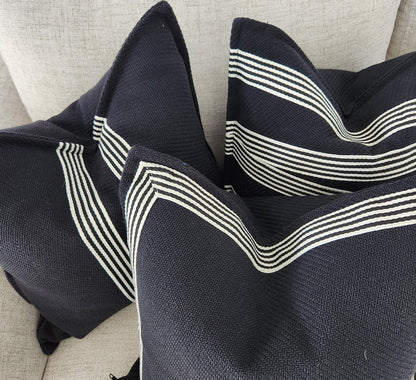 Channeling the sleek elegance of Milano's fashion district, each Black & White Herringbone Striped Cushion features the striking contrast of black and white, evoking the timeless beauty of the marble found in both ancient Italian villas and modern Milanese ateliers. Styled.